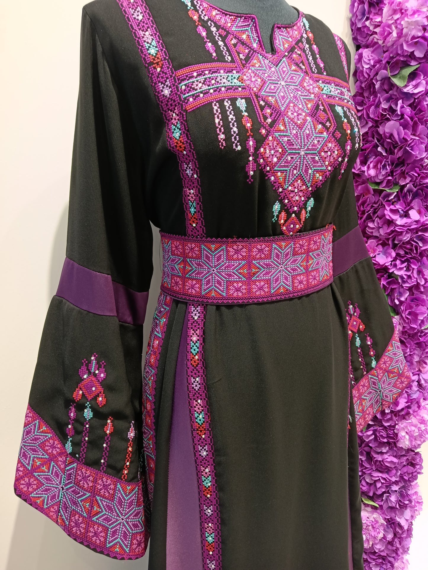 beautiful black and purple Palestinian thobe with authentic embroidery.