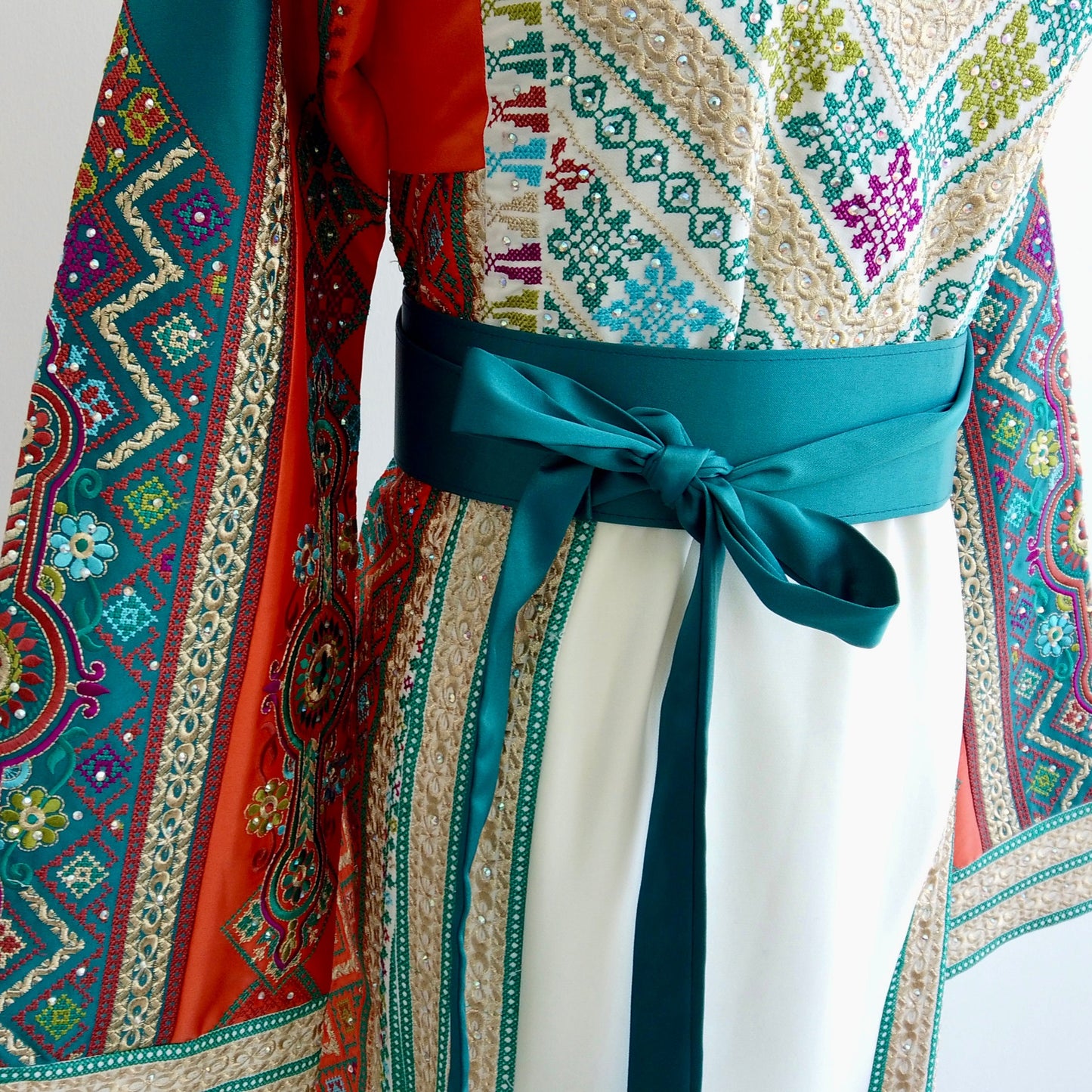 Elegant cultural thobe dress with side panels and gold sleeve tassels