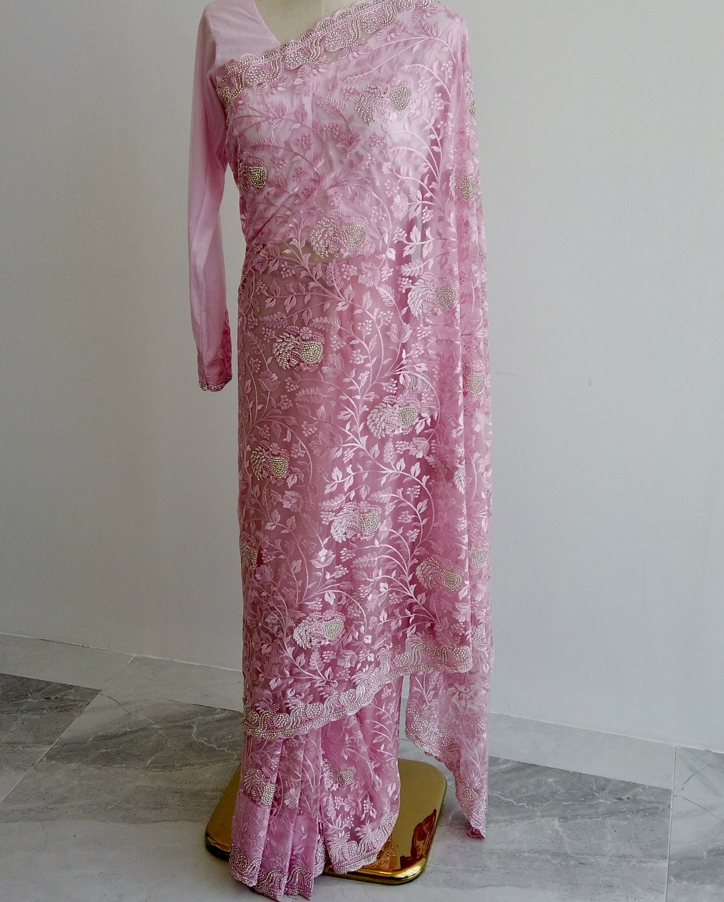 Full-length soft pink ready-to-wear saree with long sleeves and silver work