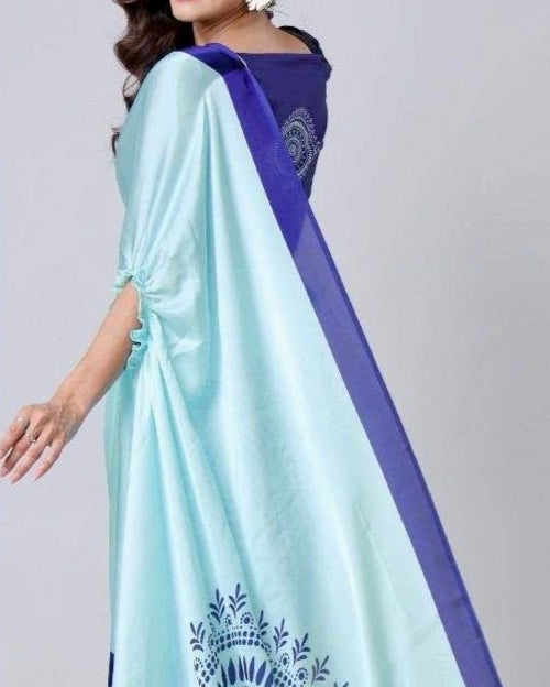 Close-up of freehand circular design and dotted accents on satin silk fabric
