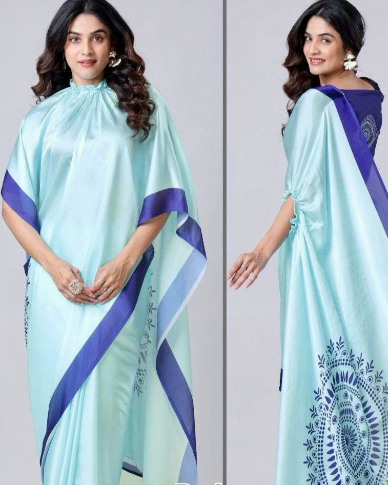 Model wearing blue kaftan-style saree at a formal event in Doha, styled with statement jewelry
