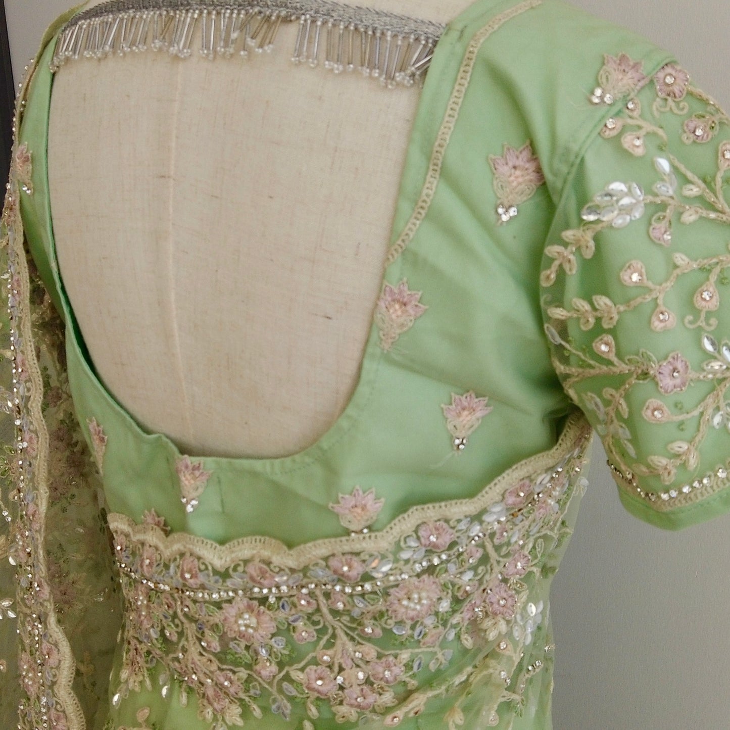 Hand-embroidered stitched saree in green with sequins and threadwork