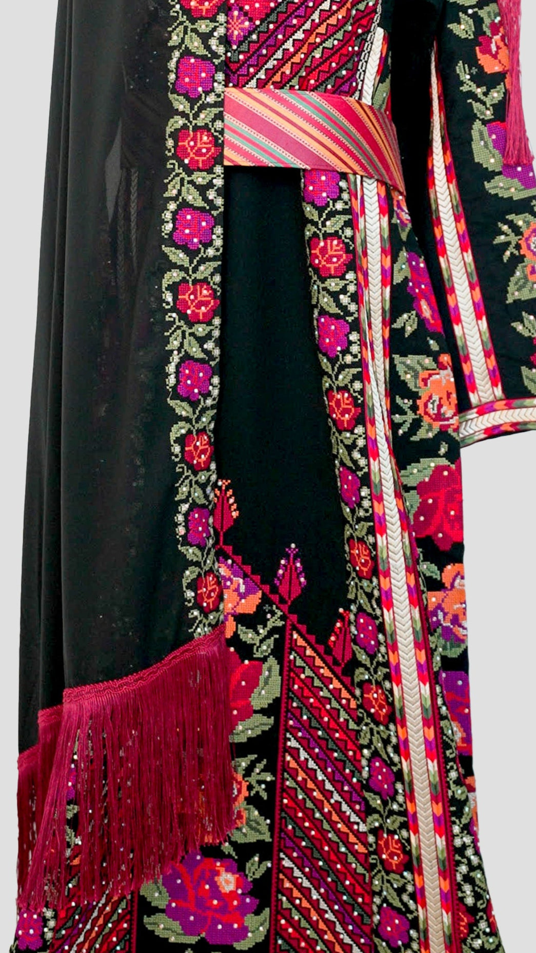 Side view of thobe showing flowing silhouette and detailed pattern placement