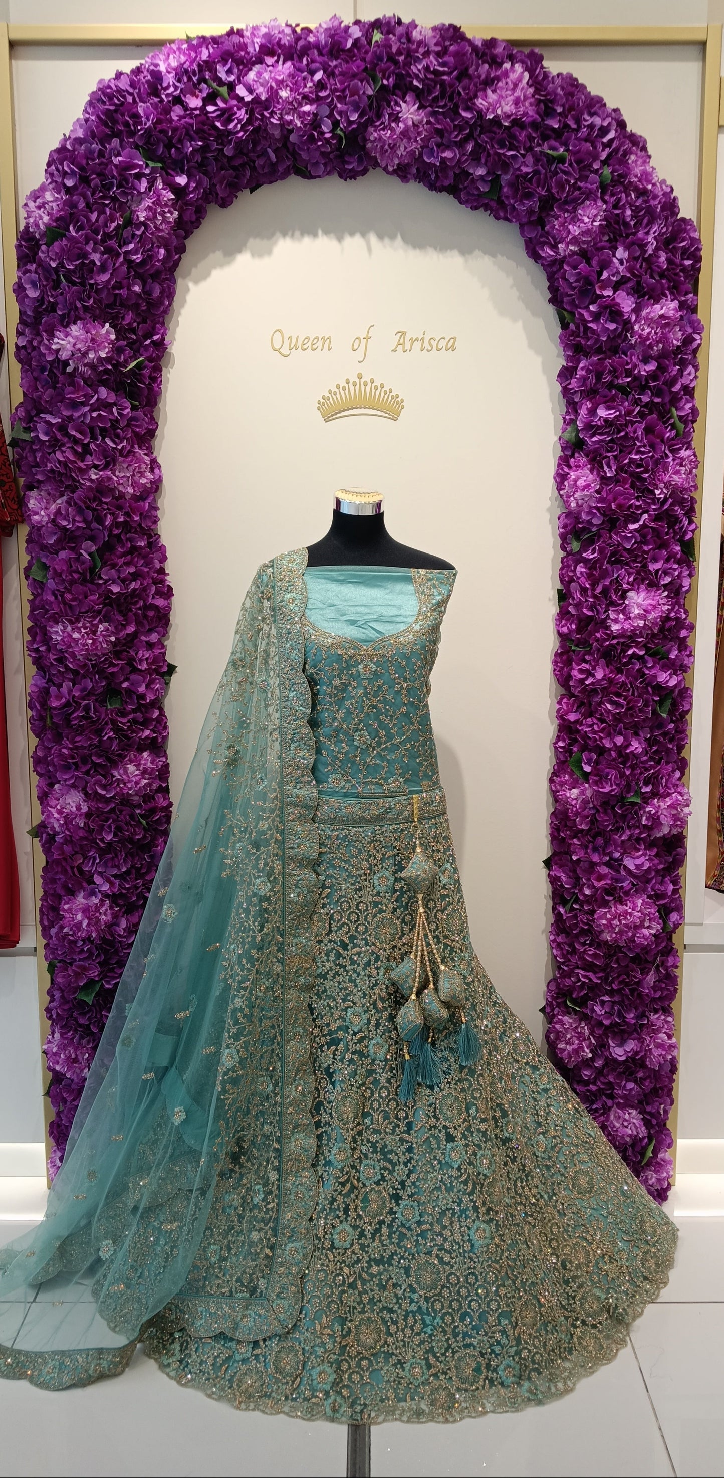 A stunning aqua blue lehenga with dense antique gold zari and stone embroidery throughout