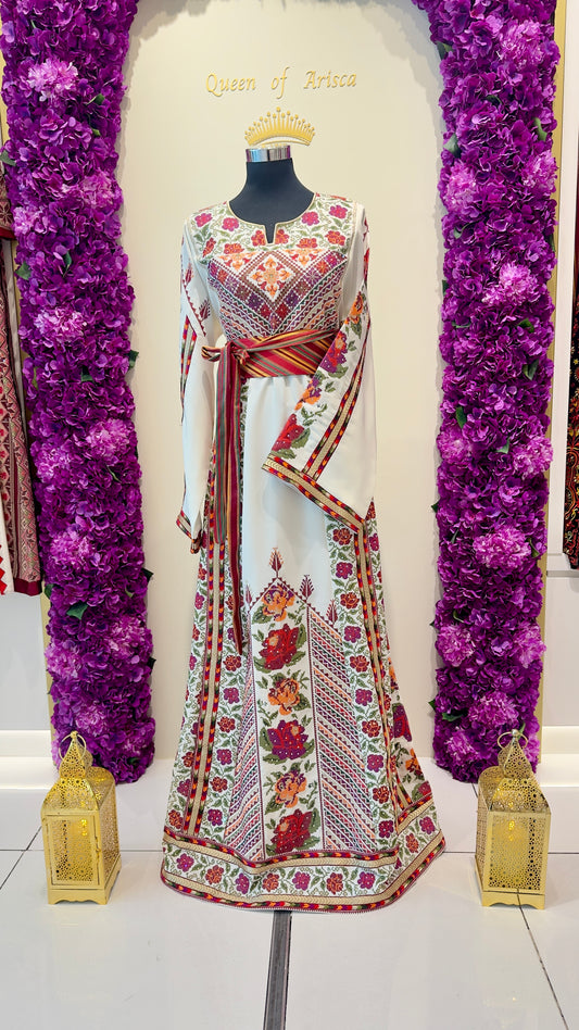 Traditional embroidered outfit on a mannequin with purple floral decorations and 'Queen of Hearts' text.