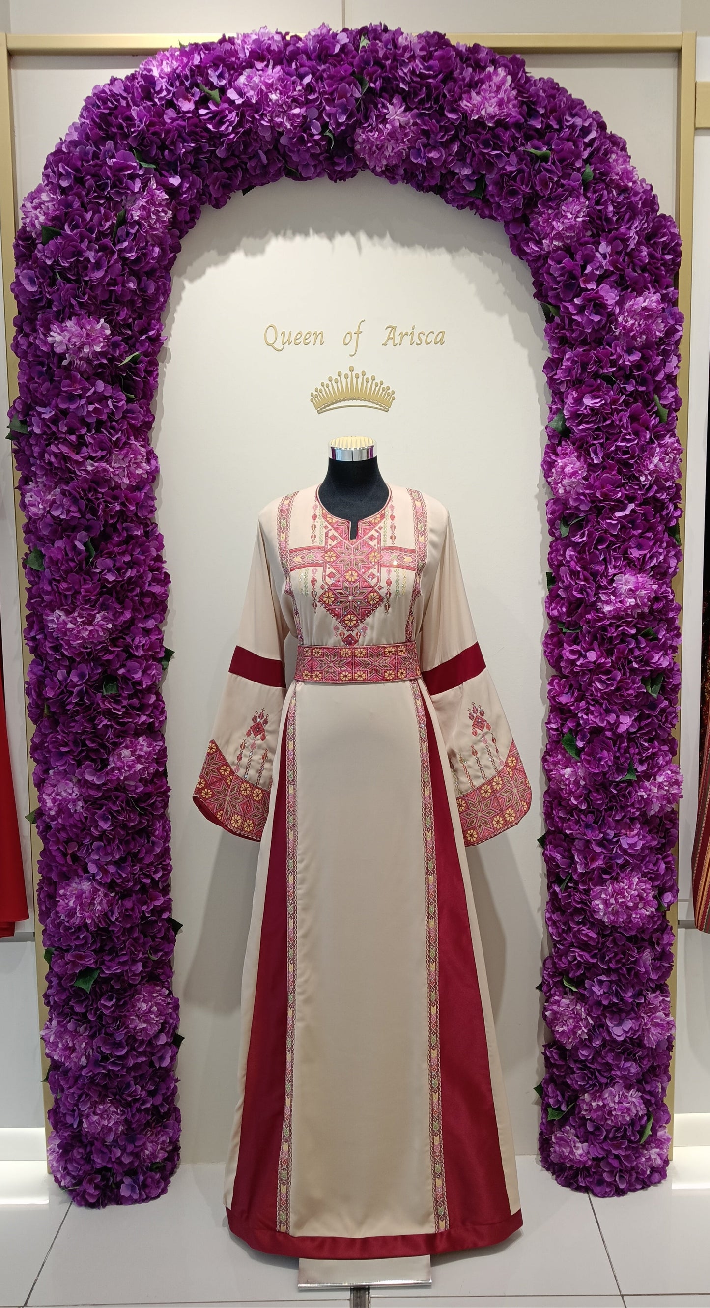 Palestinian thobe is a masterpiece of heritage and elegance. Crafted from premium cream fabric with rich maroon panels