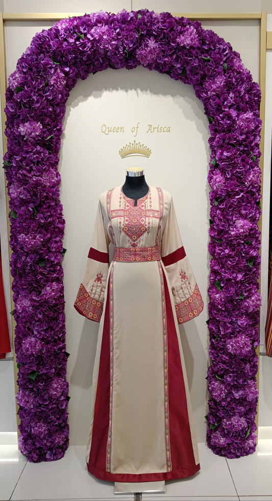 Palestinian thobe is a masterpiece of heritage and elegance. Crafted from premium cream fabric with rich maroon panels