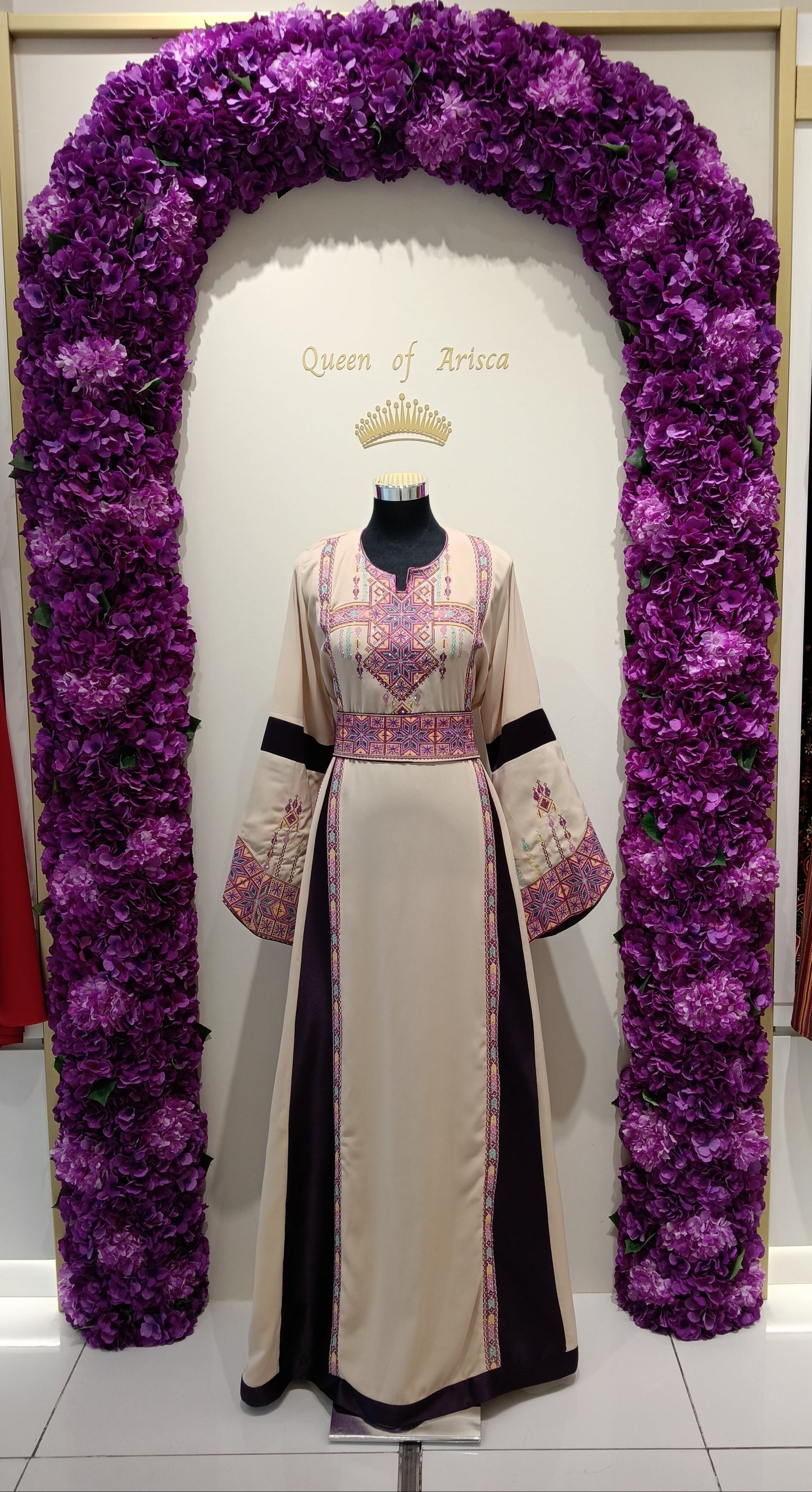 refined Palestinian thobe made from premium lightweight fabric featuring a soft beige base complemented by deep plum side panels.