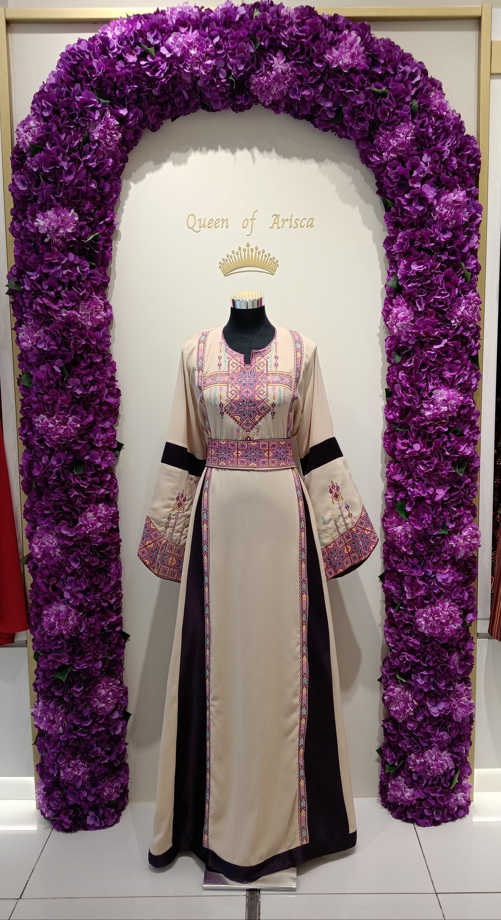 refined Palestinian thobe made from premium lightweight fabric featuring a soft beige base complemented by deep plum side panels.
