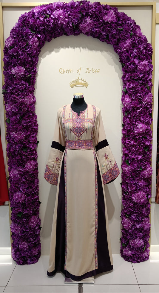 refined Palestinian thobe made from premium lightweight fabric featuring a soft beige base complemented by deep plum side panels.