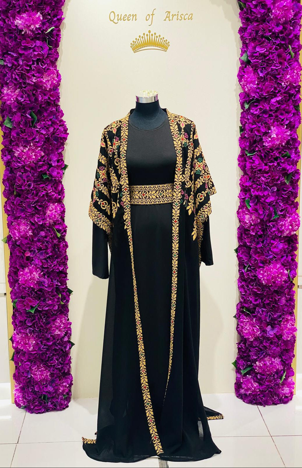 Luxury black Palestinian Thobe featuring royal gold Tatreez embroidery.