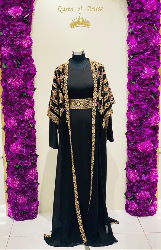 Luxury black Palestinian Thobe featuring royal gold Tatreez embroidery.