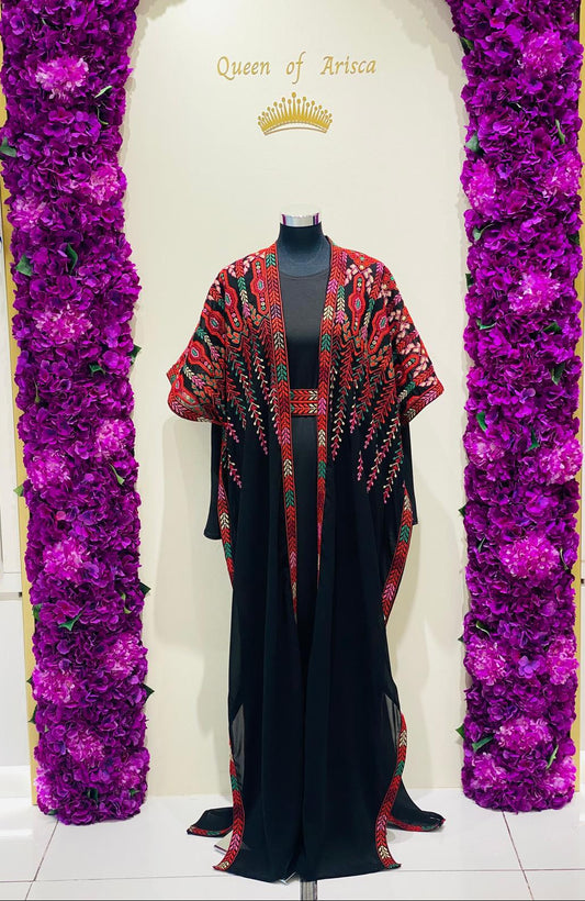  Elegant black Palestinian thobe, beautifully detailed with vibrant red and green geometric embroidery.