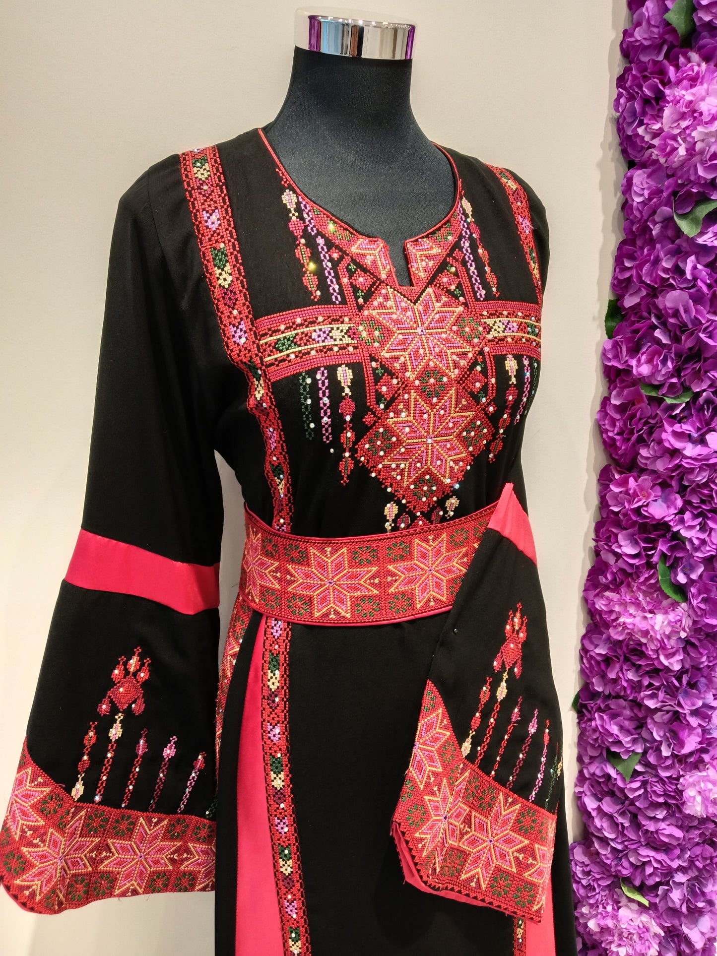 elegant black and red embroidered Palestinian thobe.