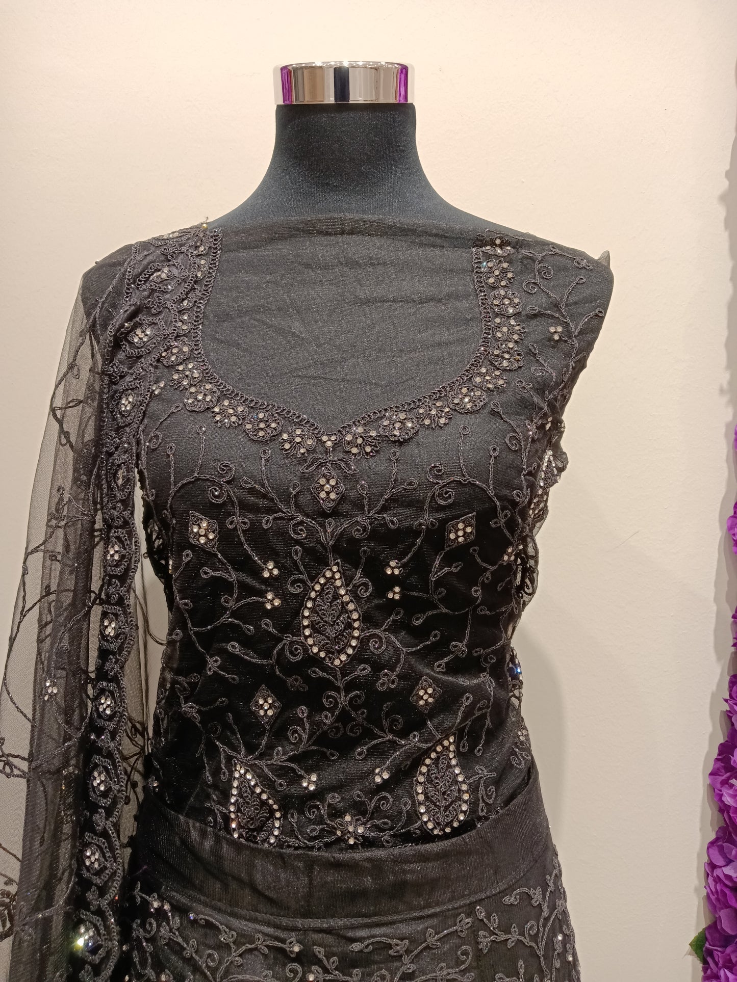 elegant black lehenga with silver and white stonework detailing.