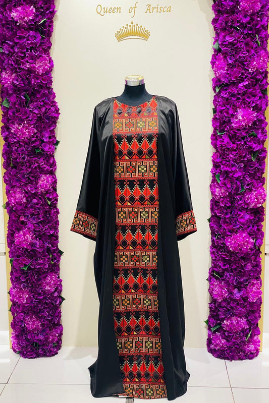  Luxury black Palestinian thobe at Arisca, featuring bold red geometric embroidery.
