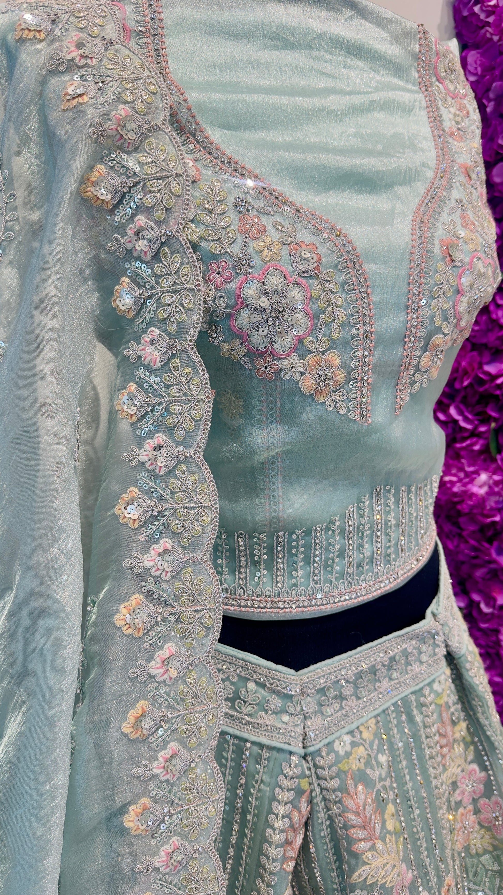 Close-up of a traditional embroidered garment with intricate patterns.