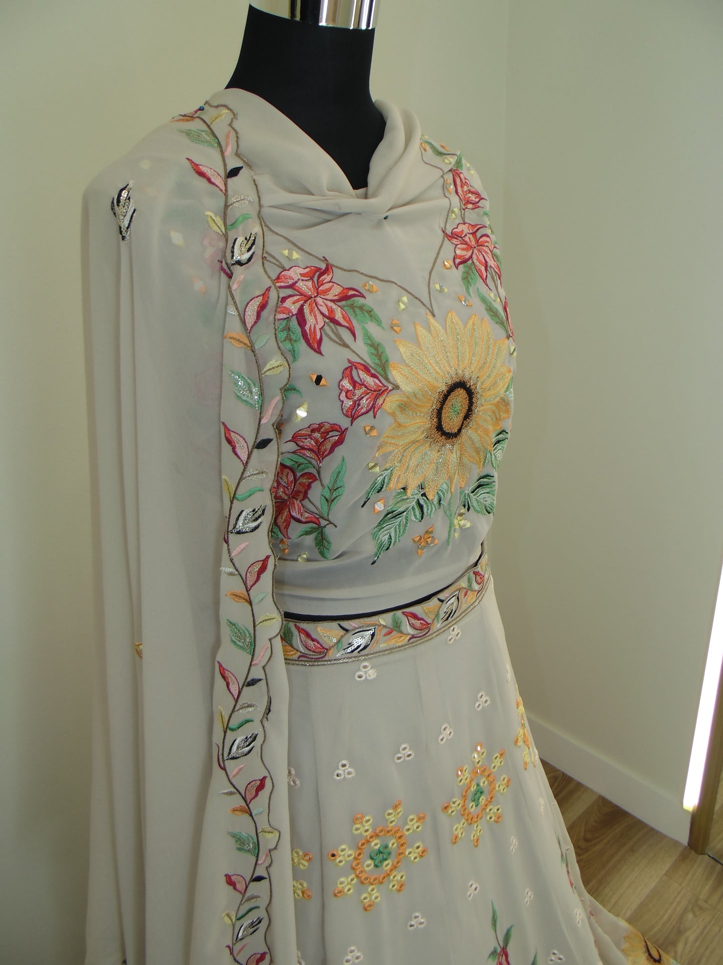 Embroidered Lehenga on a hanger with floral patterns