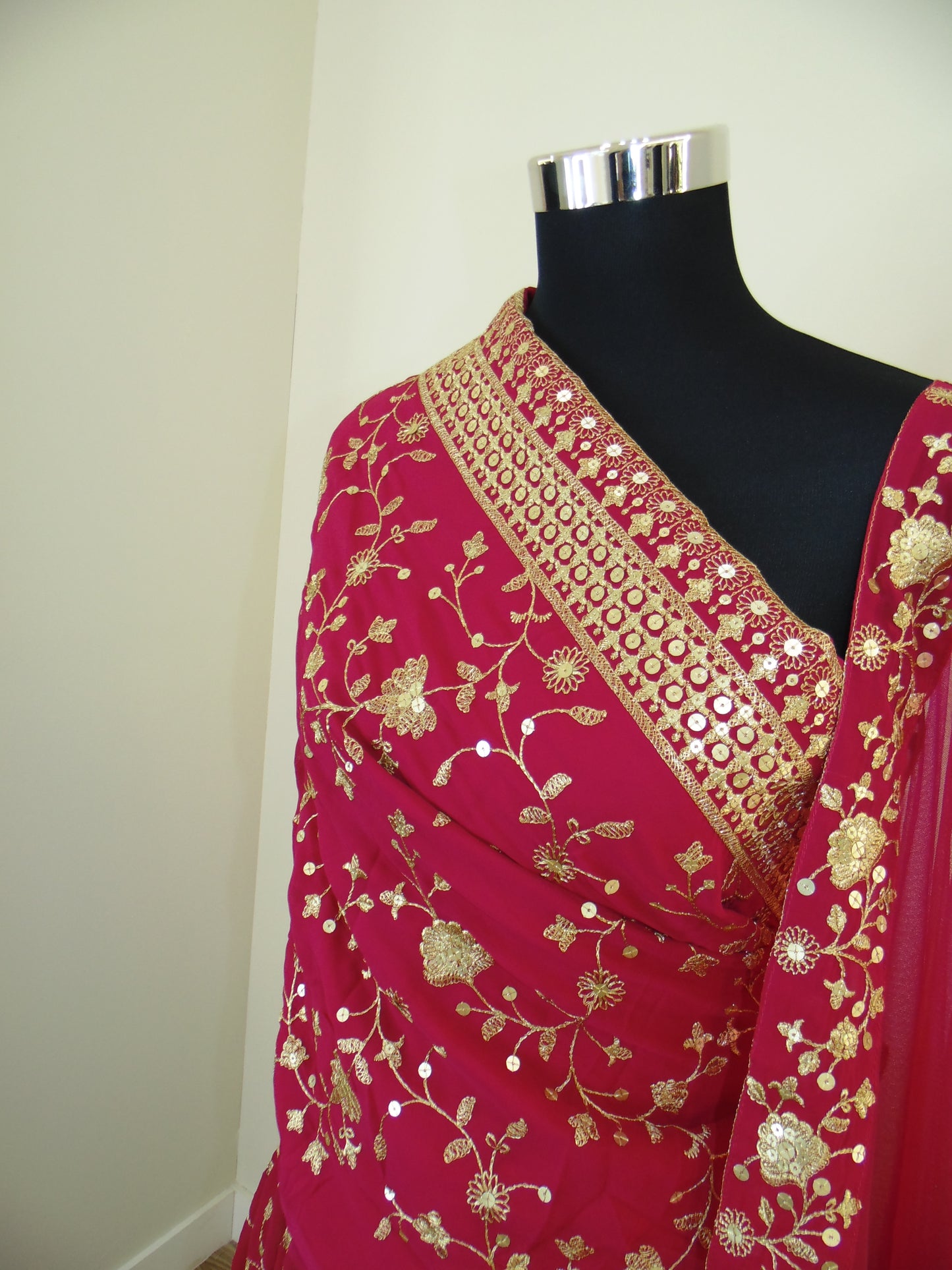 Red Indian Lehenga with gold embroidery on a white background