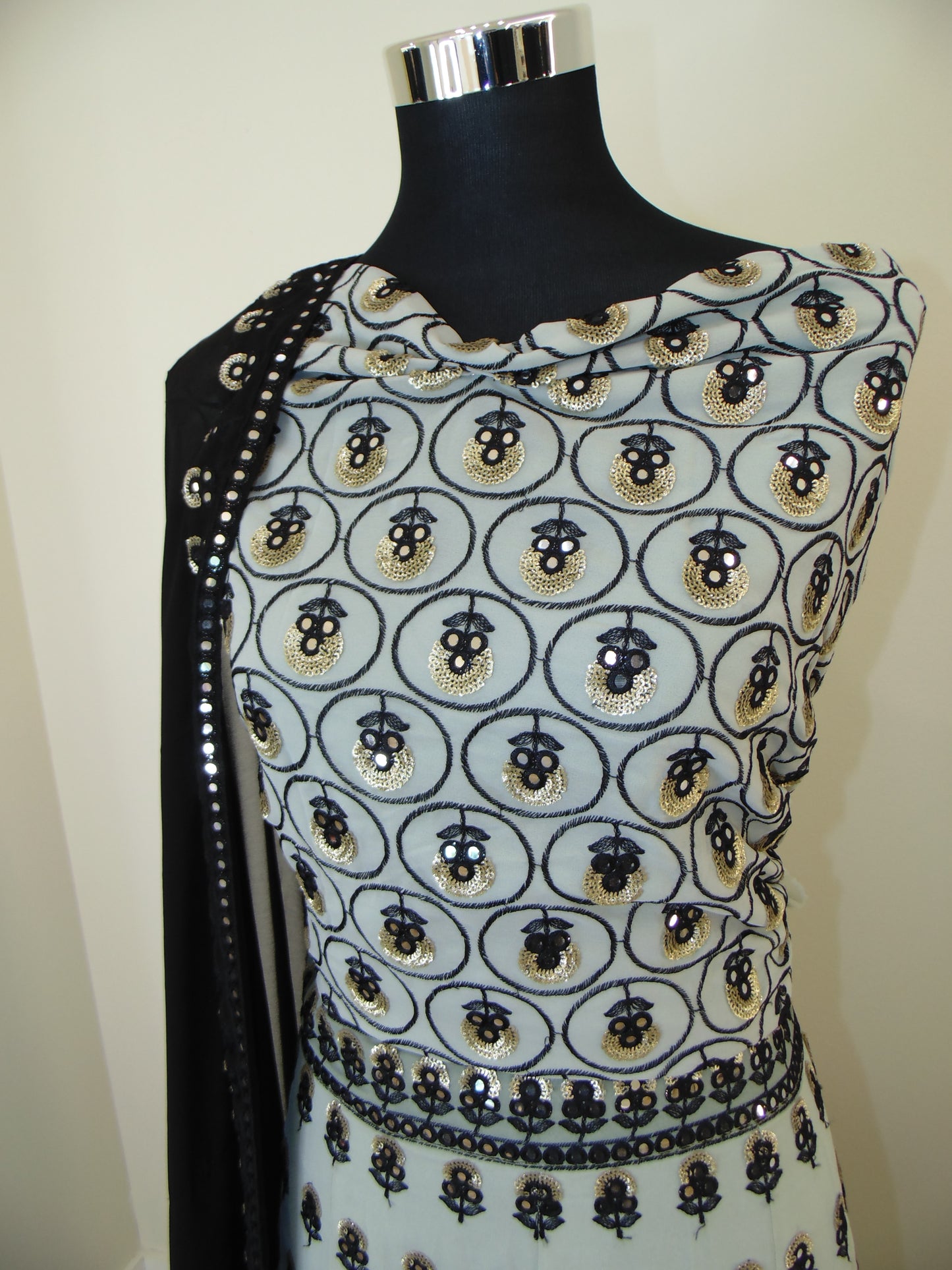 Patterned Indian Lehenga with Mirror work embroidery on a light background