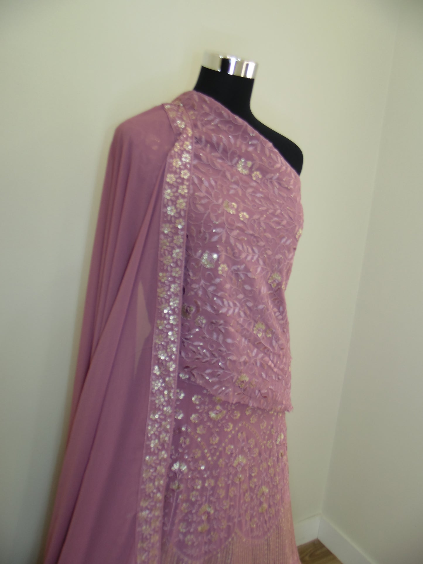 Pink Indian Lehenga with sequin details on a white surface