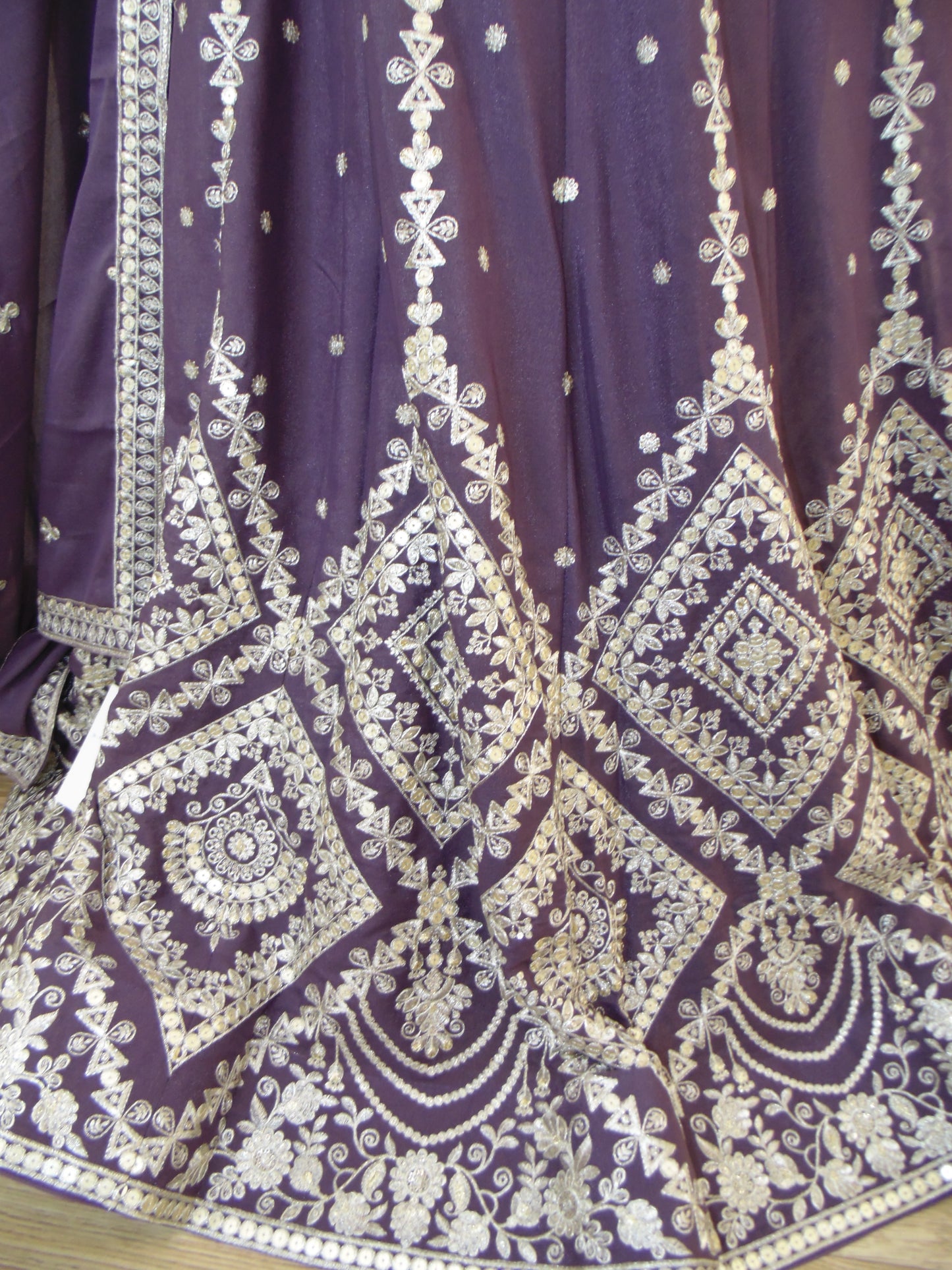 Purple fabric with white intricate patterns