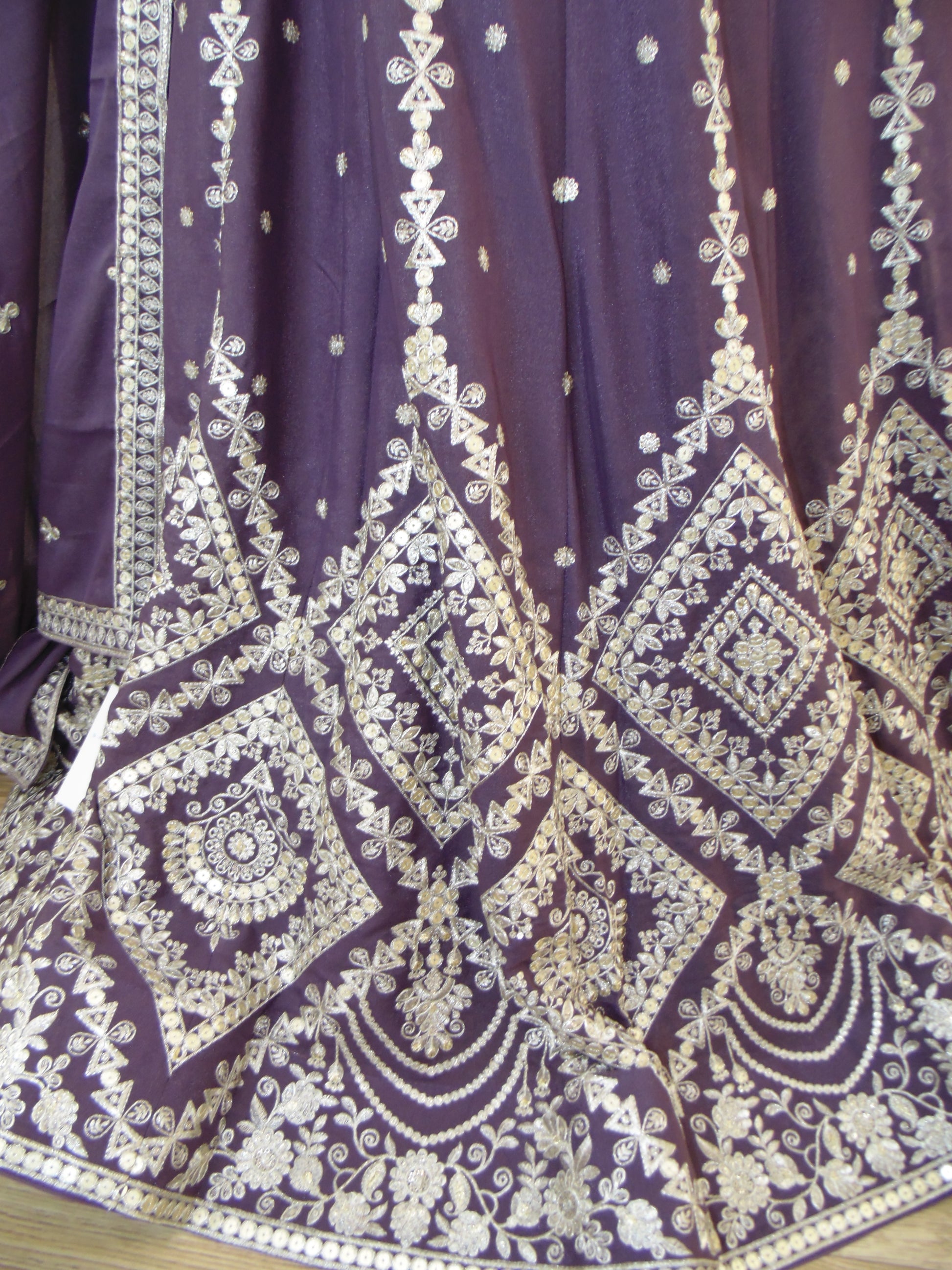 Purple fabric with white intricate patterns