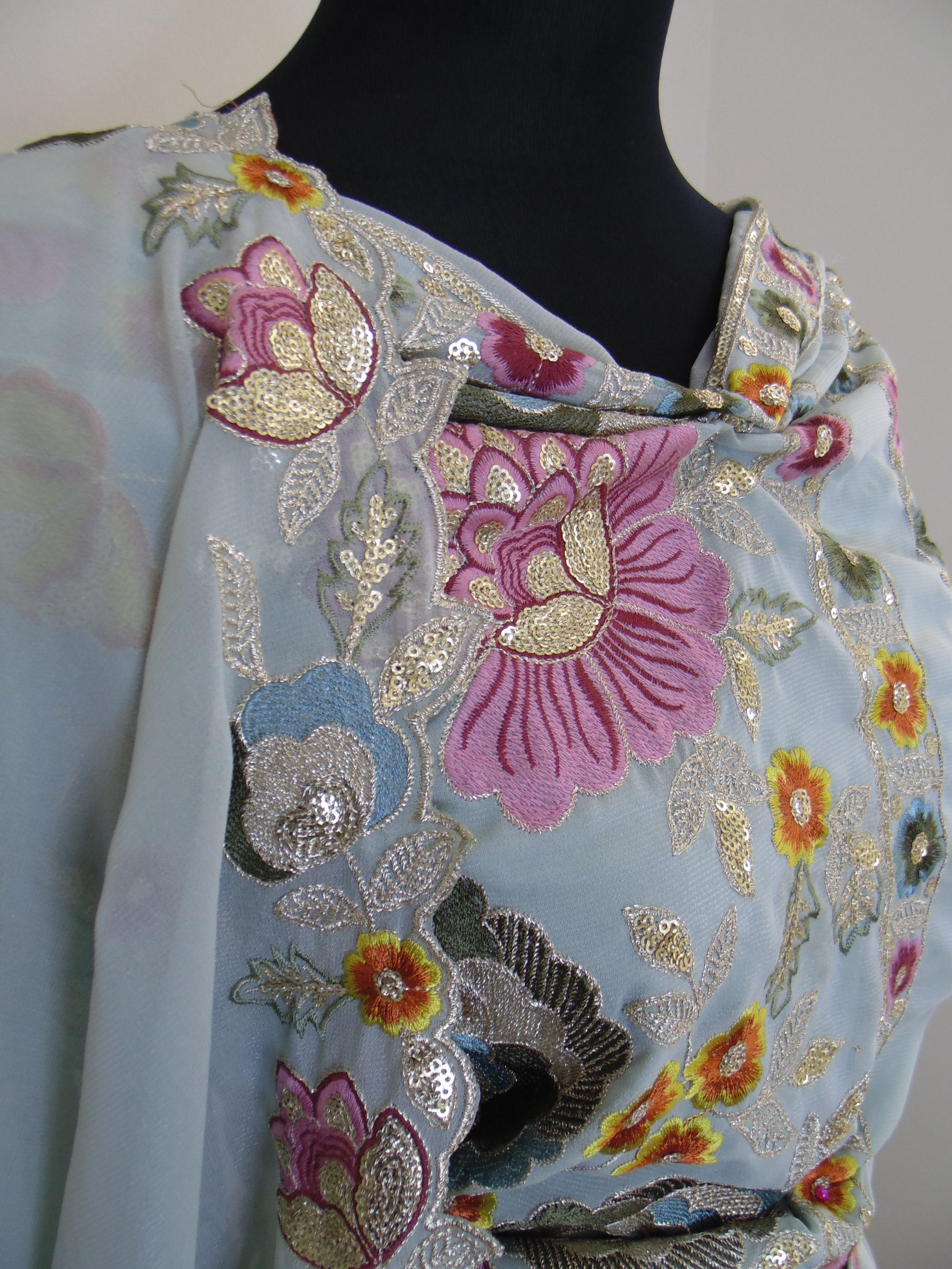 Embroidered fabric with floral patterns on a plain background