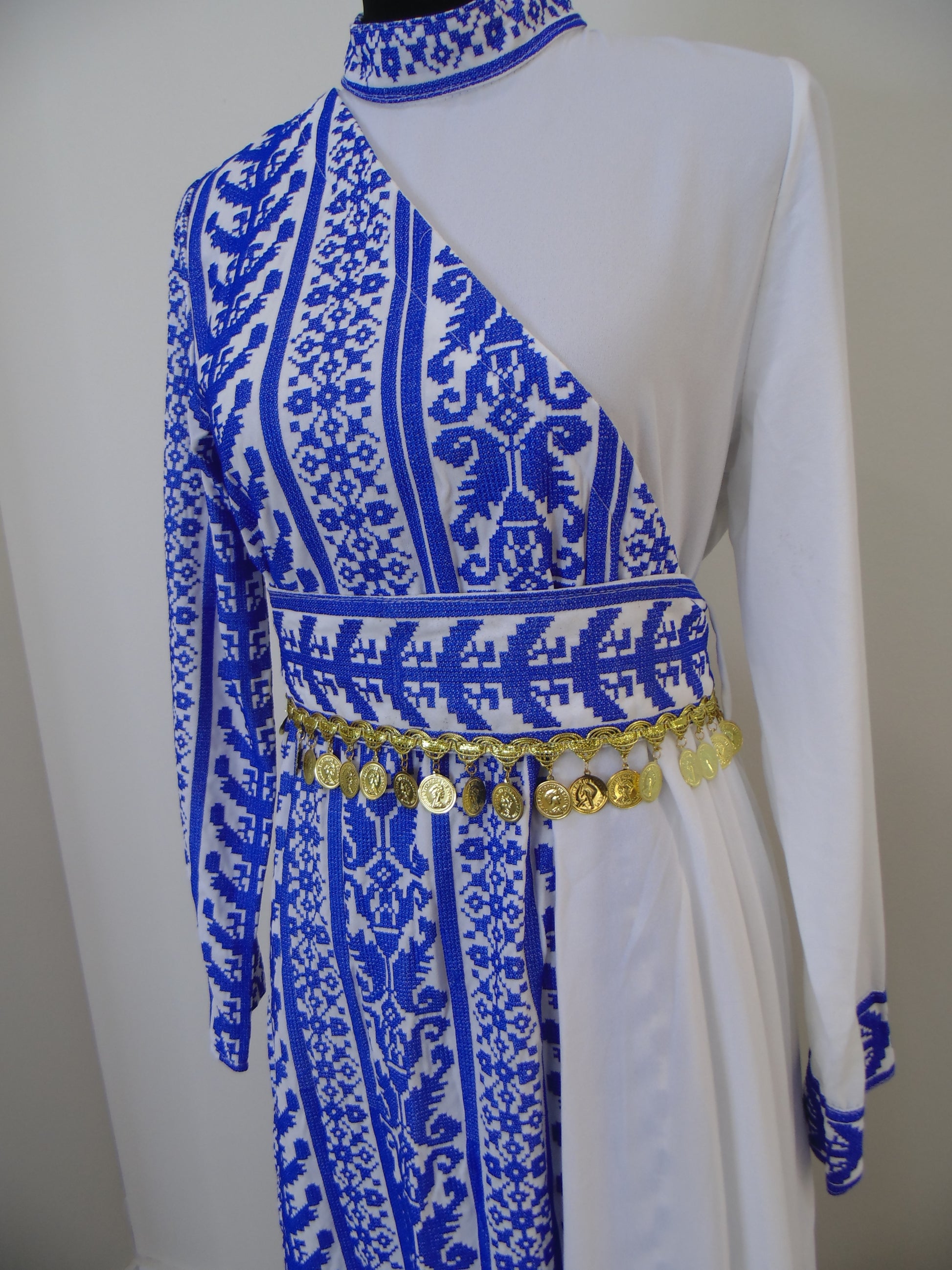 Traditional garment with blue and white patterns on a white background
