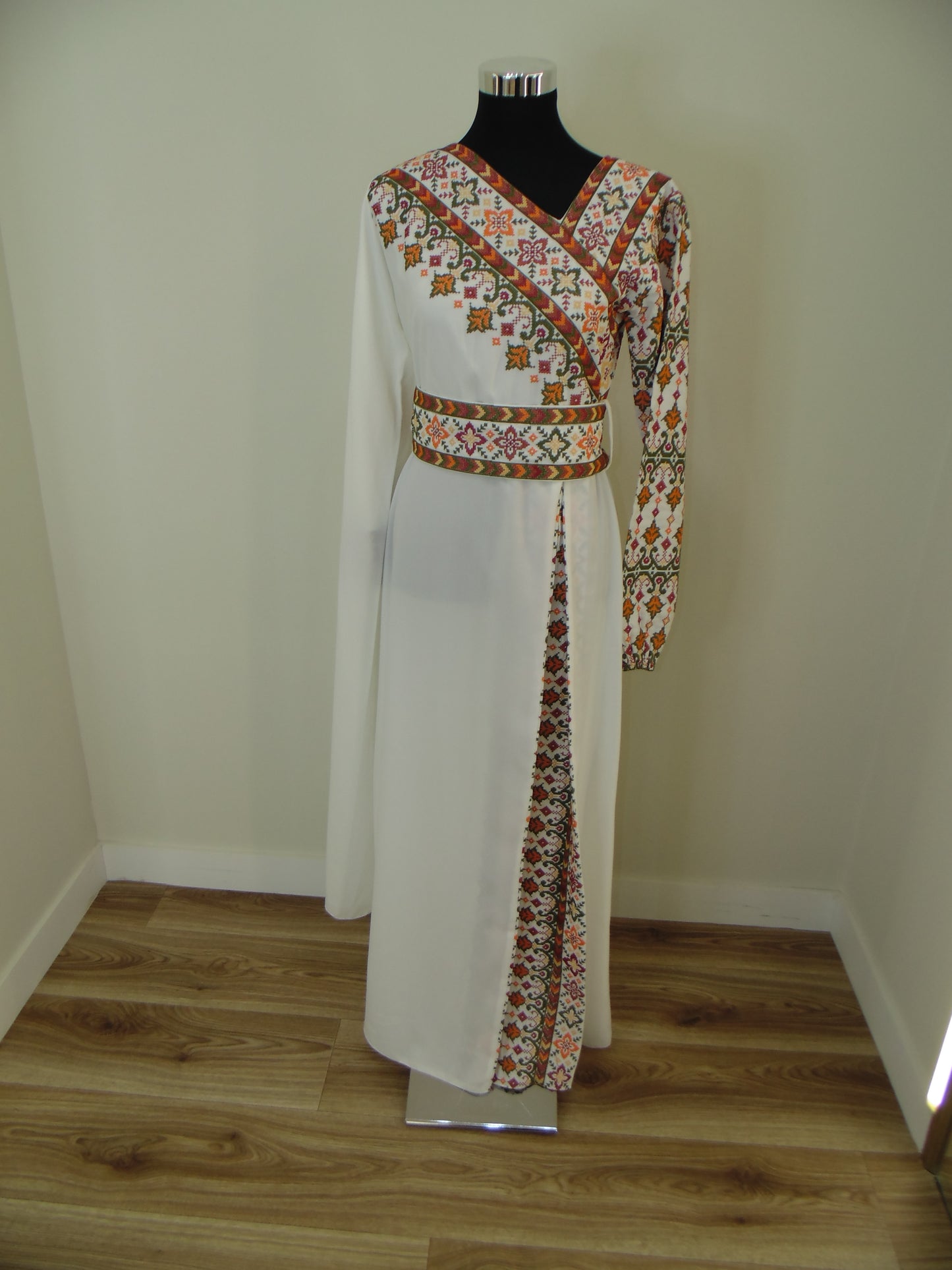 Decorative kitchen hood with floral pattern on a wooden floor