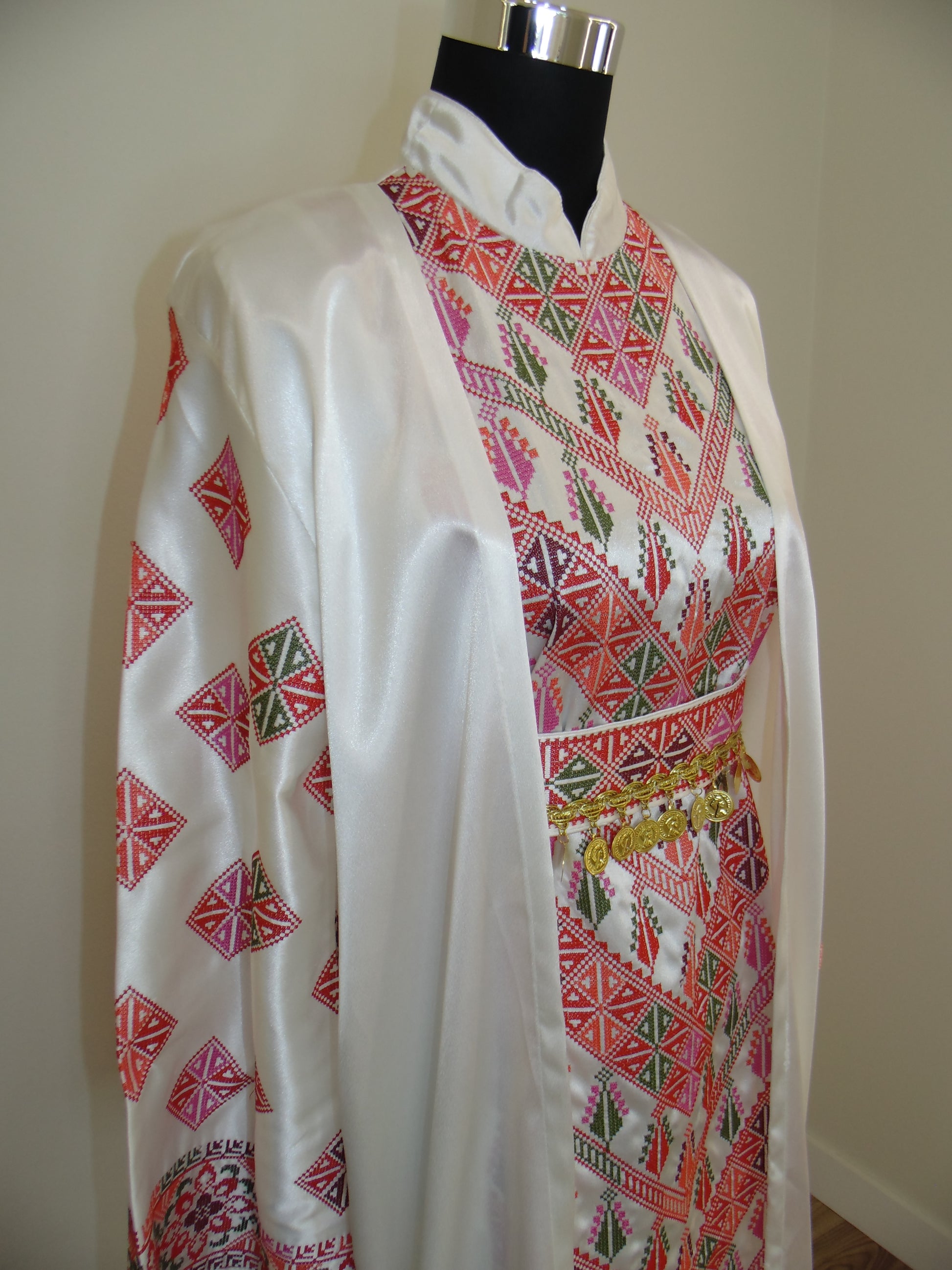 Embroidered fabric with geometric patterns on a plain background