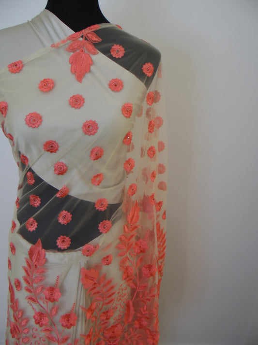 Saree with floral embroidery on a mannequin against a white background