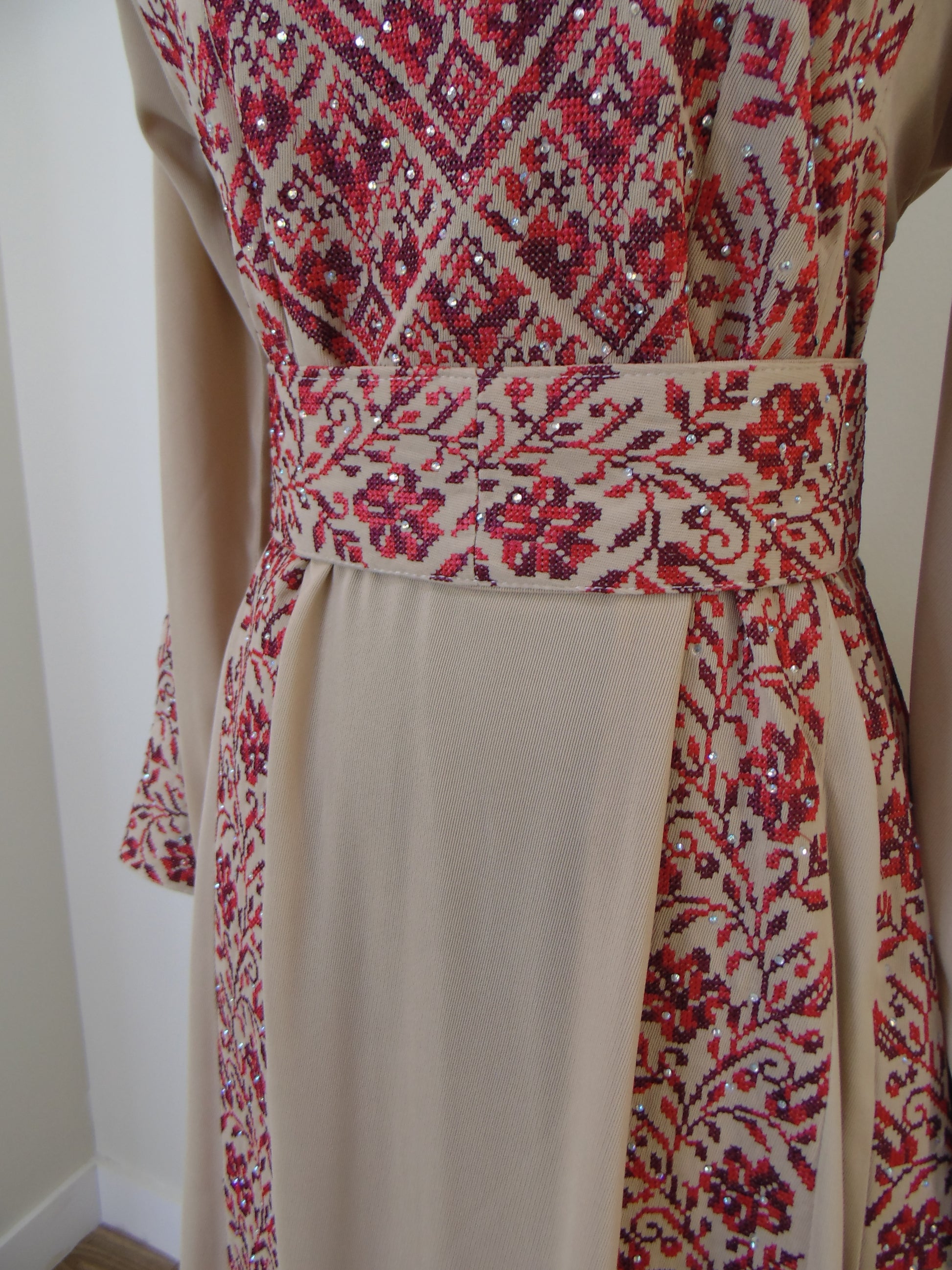 Close-up of a fabric with red and white pattern on a white background
