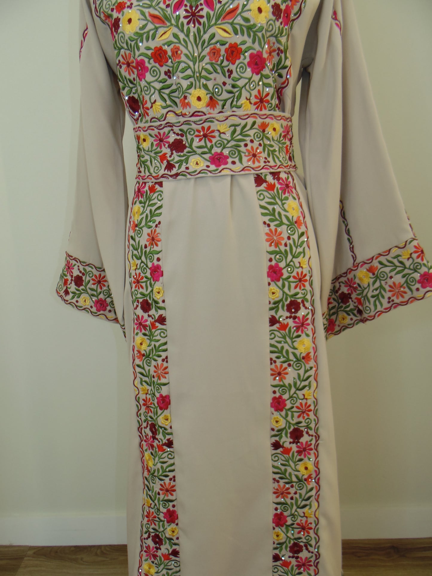 Fabric with floral embroidery on a plain background