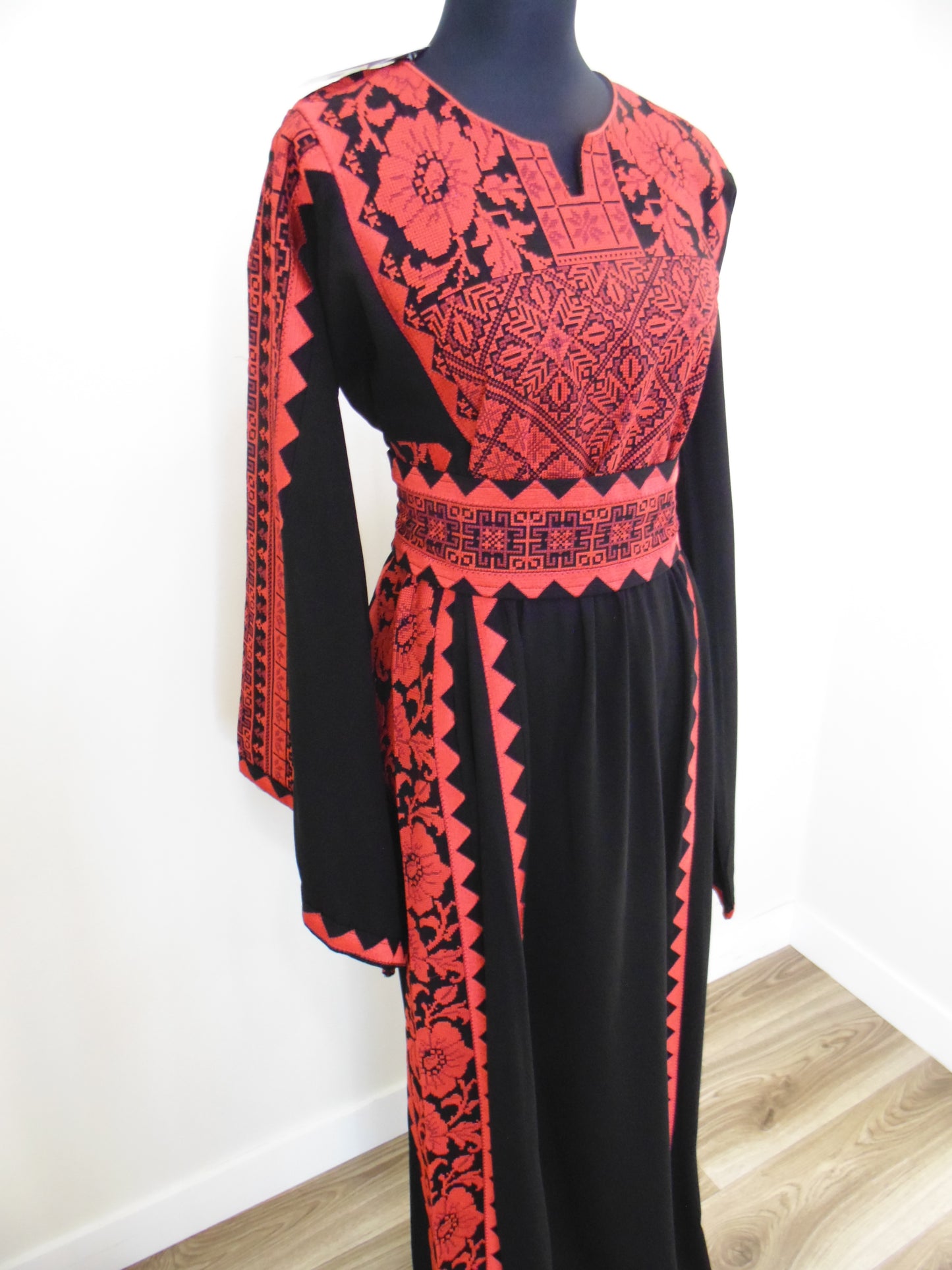 Black and red patterned glove on a white background