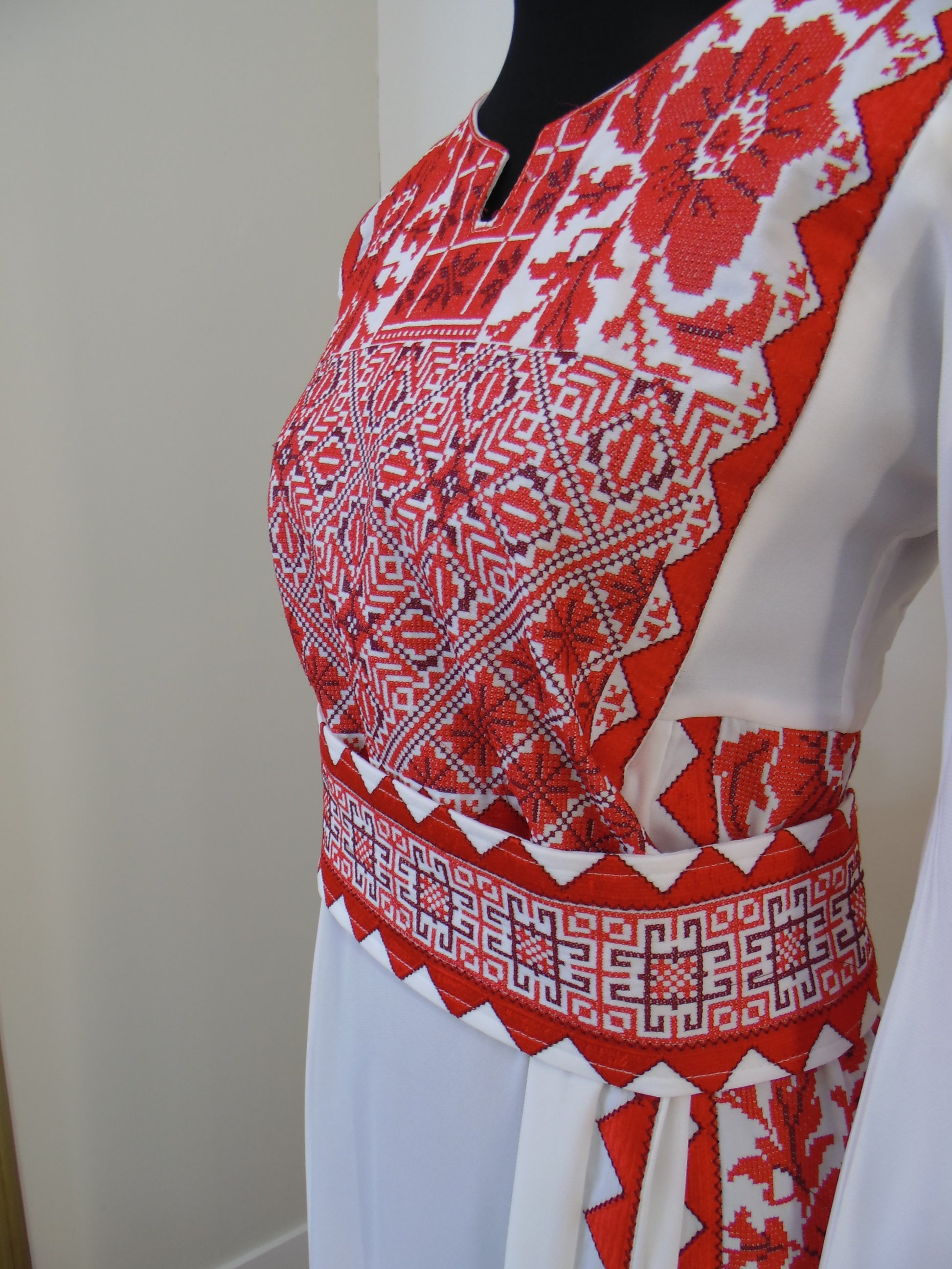 Red and white patterned fabric on a white background