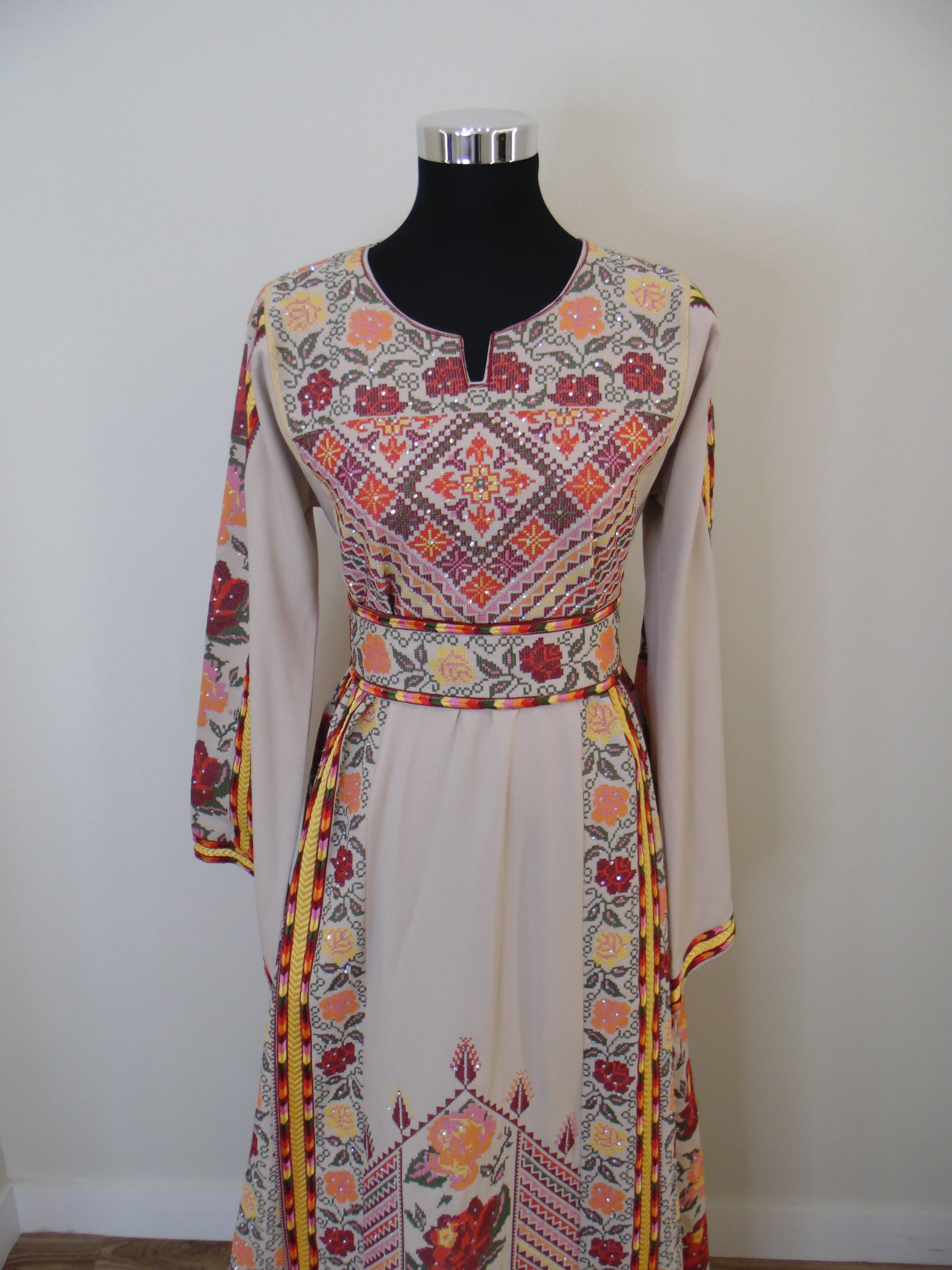 Colorful embroidered garment on a white background