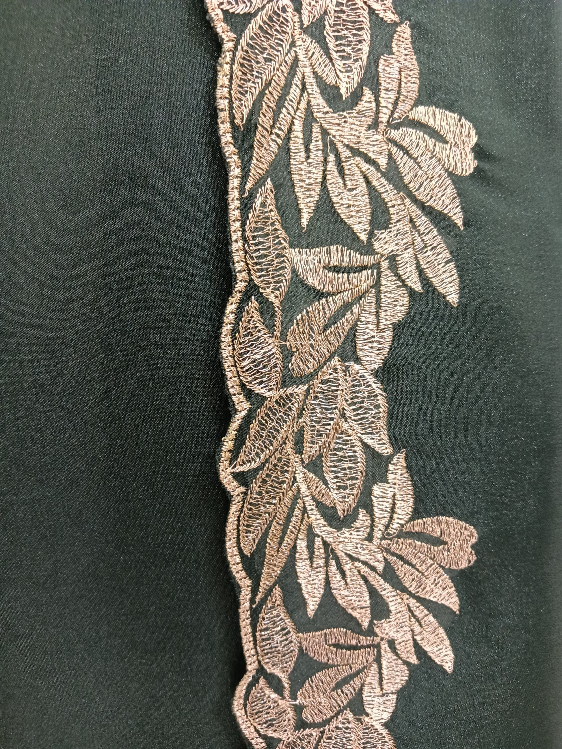 forest green ready-to-wear saree, designed for effortless elegance in Qatar. Crafted from a lightweight shimmer fabric, it drapes beautifully while offering comfort for long events.