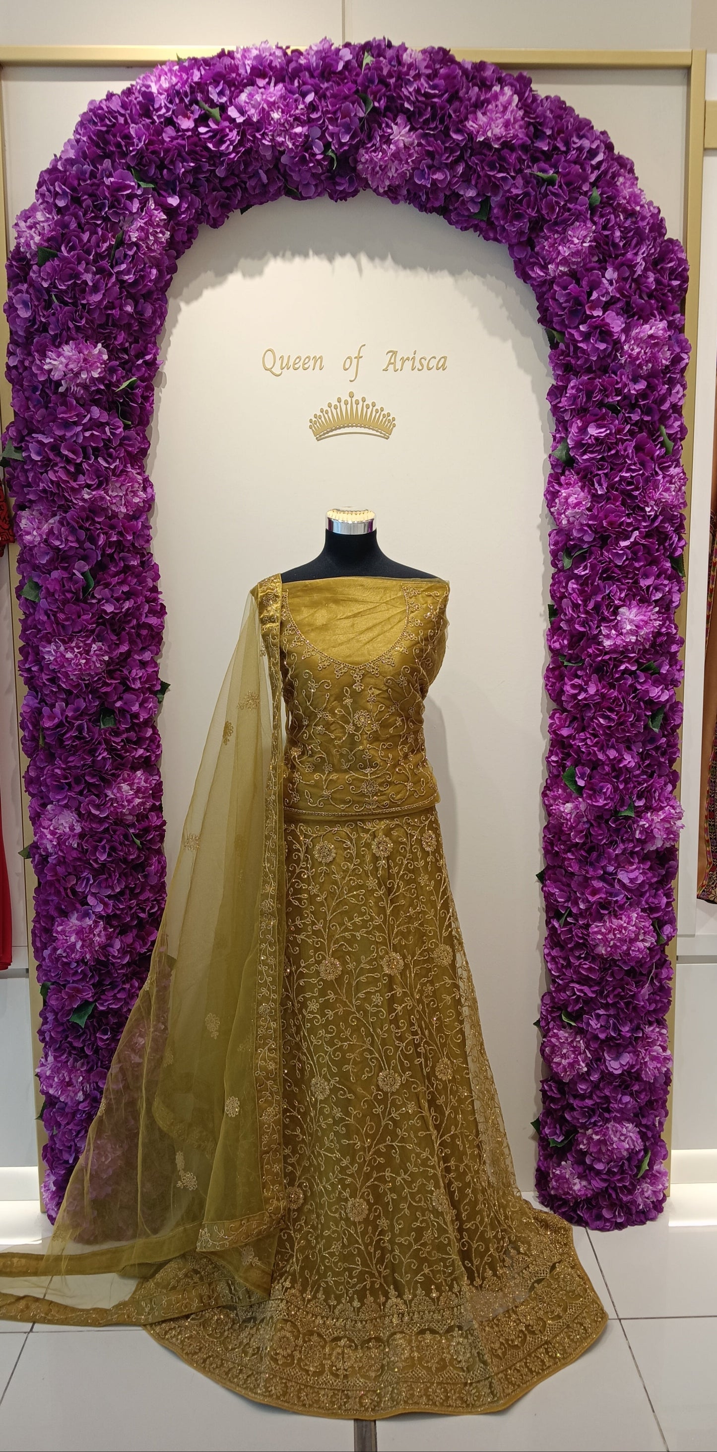 rich antique gold base with all-over intricate zari and floral thread embroidery