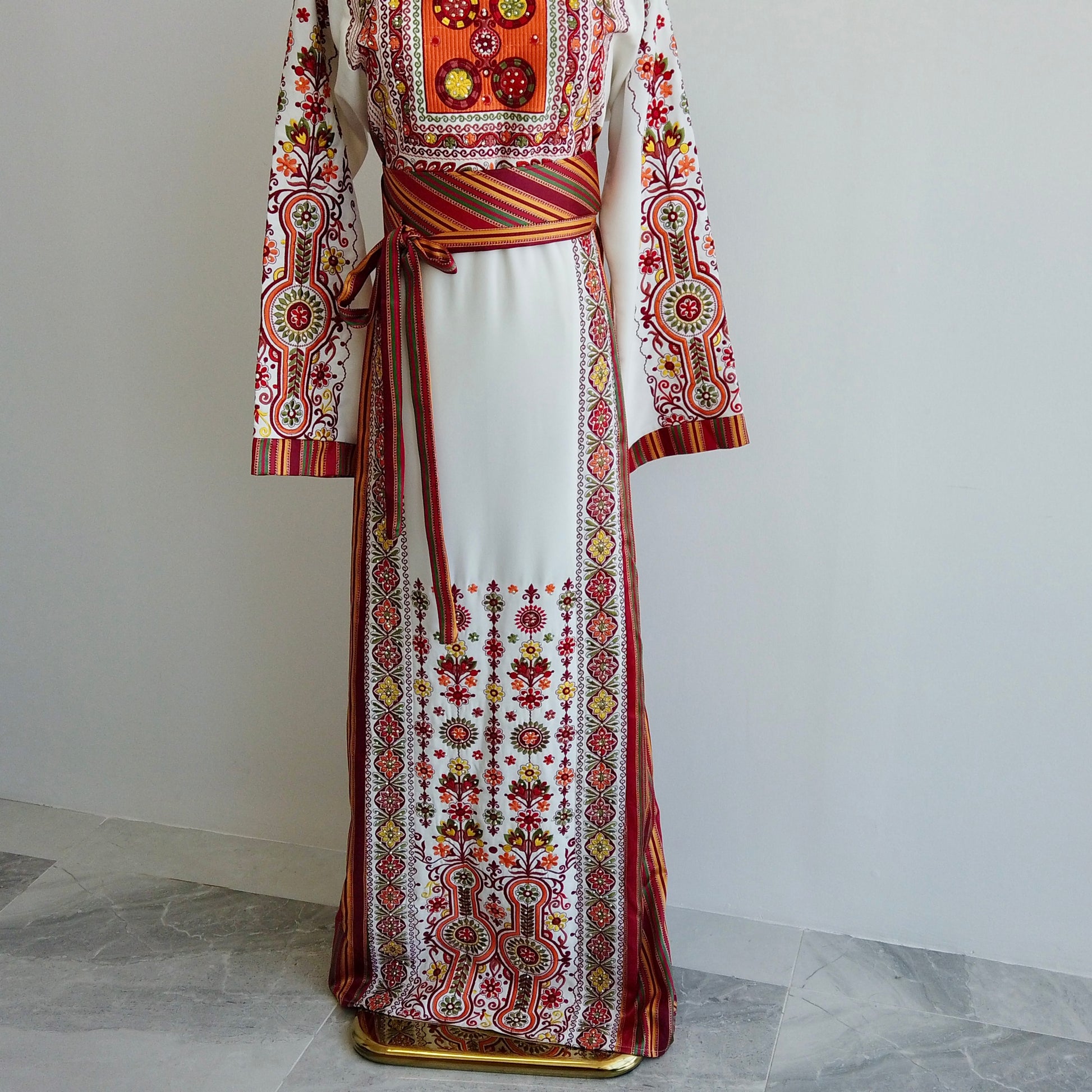 Full-length traditional white thobe with tatreez, belt and fringed shawl