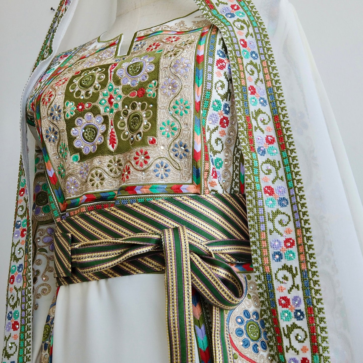 Side angle showcasing drape of the fabric and heritage-inspired belt cinching the waist