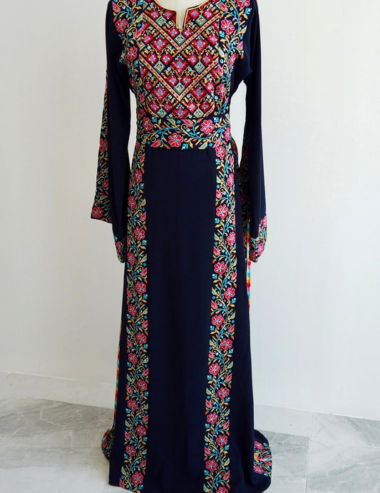 Traditional blue Palestinian thobe with detailed floral embroidery and coordinating belt by Arisca, designed for elegant cultural wear in Qatar.