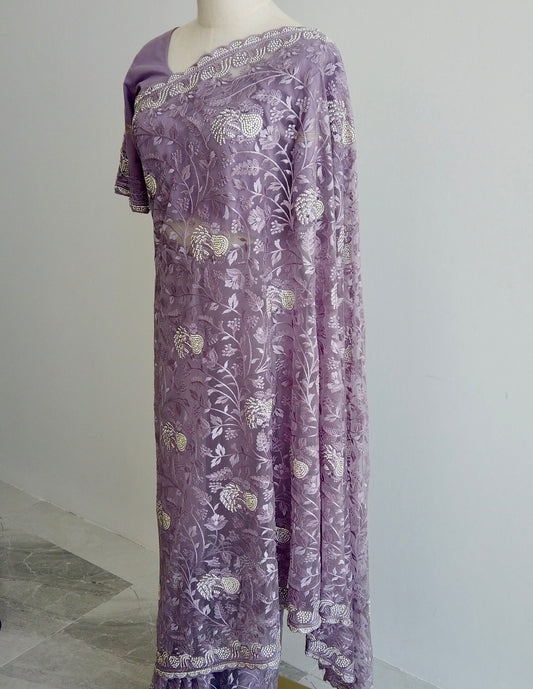 Lavender net ready-to-wear saree with gold floral embroidery displayed on a mannequin