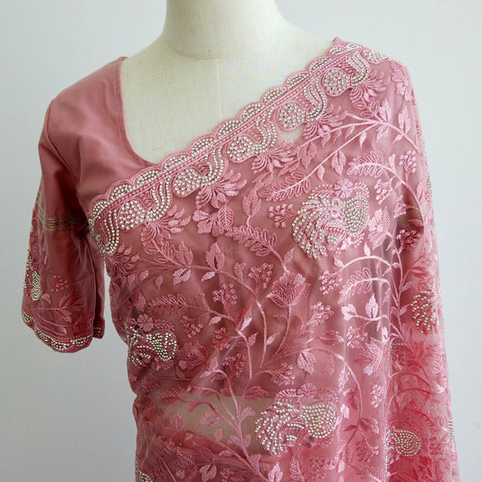 Pink net ready-to-wear saree with silver floral embroidery displayed on a mannequin
