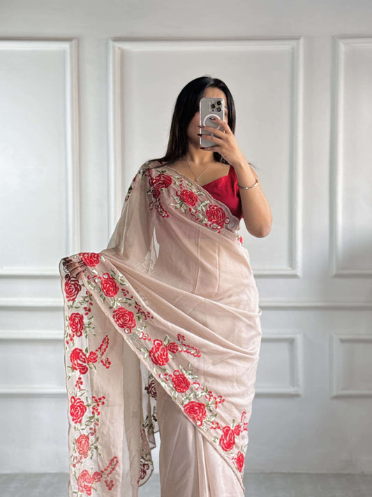 Full-length view of beige organza saree showing pre-stitched pleats and elegant pallu.