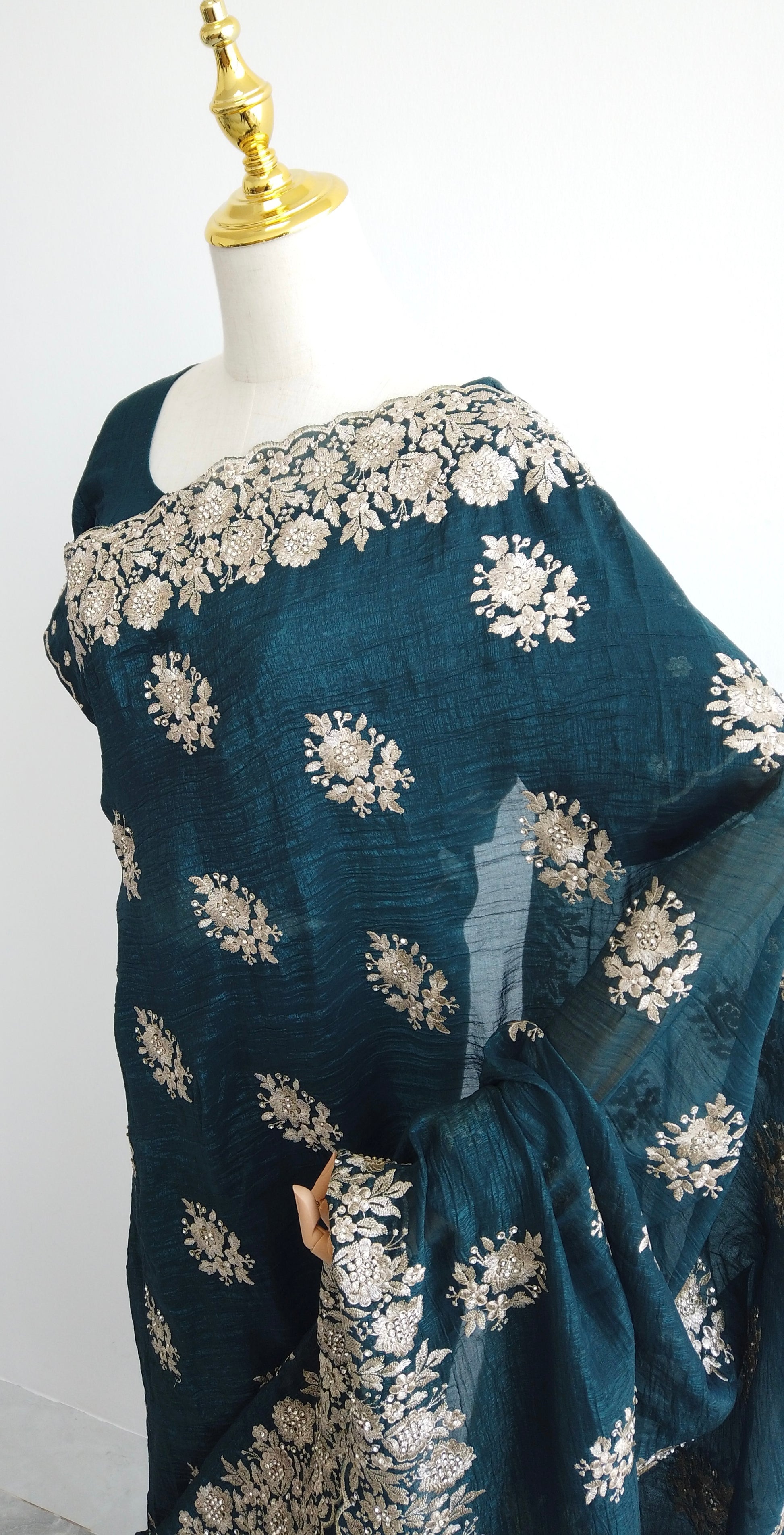 Side angle of the embroidered silk saree highlighting its luxurious texture and craftsmanship