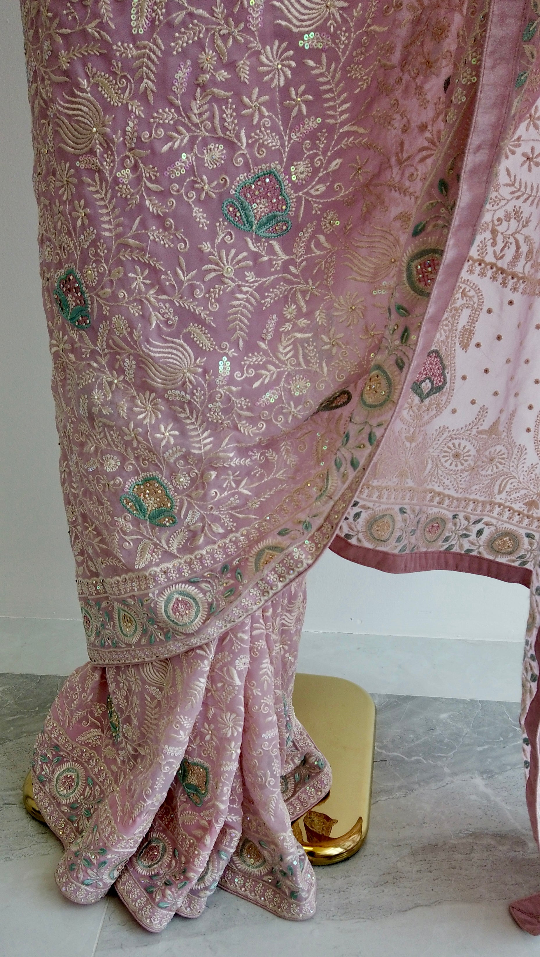 Full view of pink saree showing pre-stitched pleats