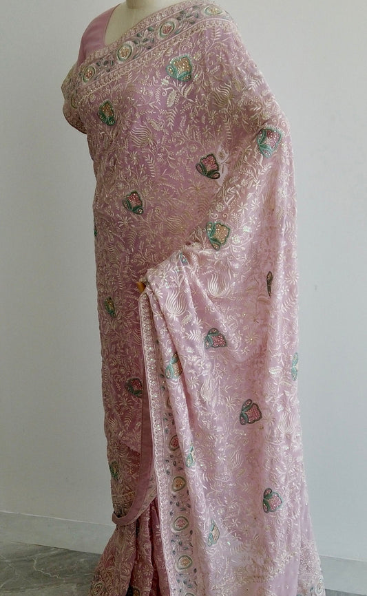 Pastel pink Lucknawi Chikankari ready-to-wear saree with intricate floral embroidery displayed on a mannequin