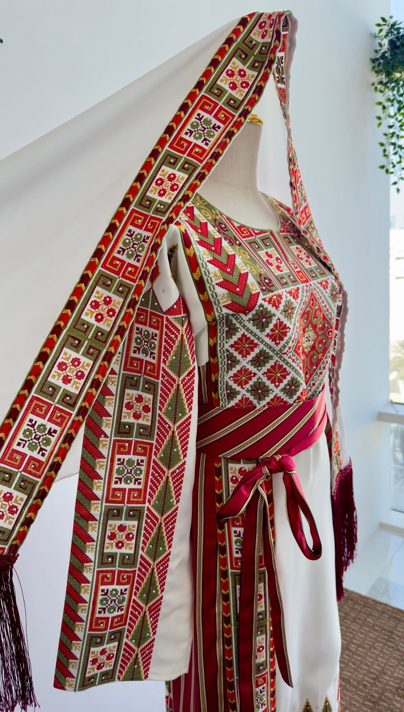 Side view highlighting fringe accents and embroidery placement on sleeve