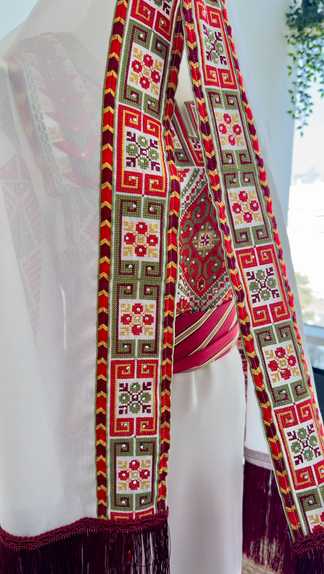 Close-up of embroidered geometric and floral motifs